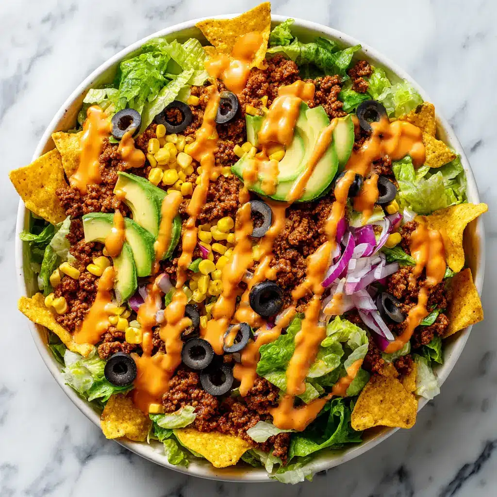 Doritos Taco Salad Recipe: The Ultimate Crowd-Pleaser 2 An overhead shot of the Doritos Taco Salad with ground beef, highlighting the fresh ingredients like lettuce, tomatoes, and shredded cheese.