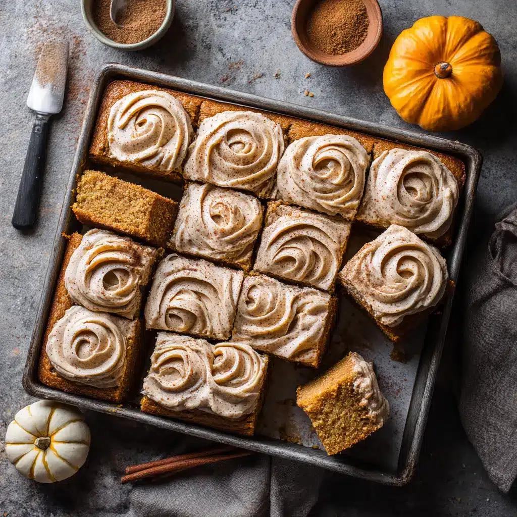 A single slice of pumpkin chai cake being lifted from the sheet pan with a spatula, revealing the moist cake crumb inside.